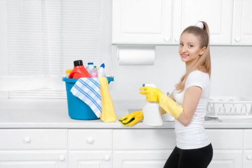 Short-let cleaner preparing a kitchen in a Hammersmith apartment