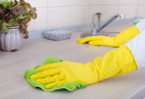 Bathroom and kitchen surfaces being refreshed during a one-off clean in Hammersmith
